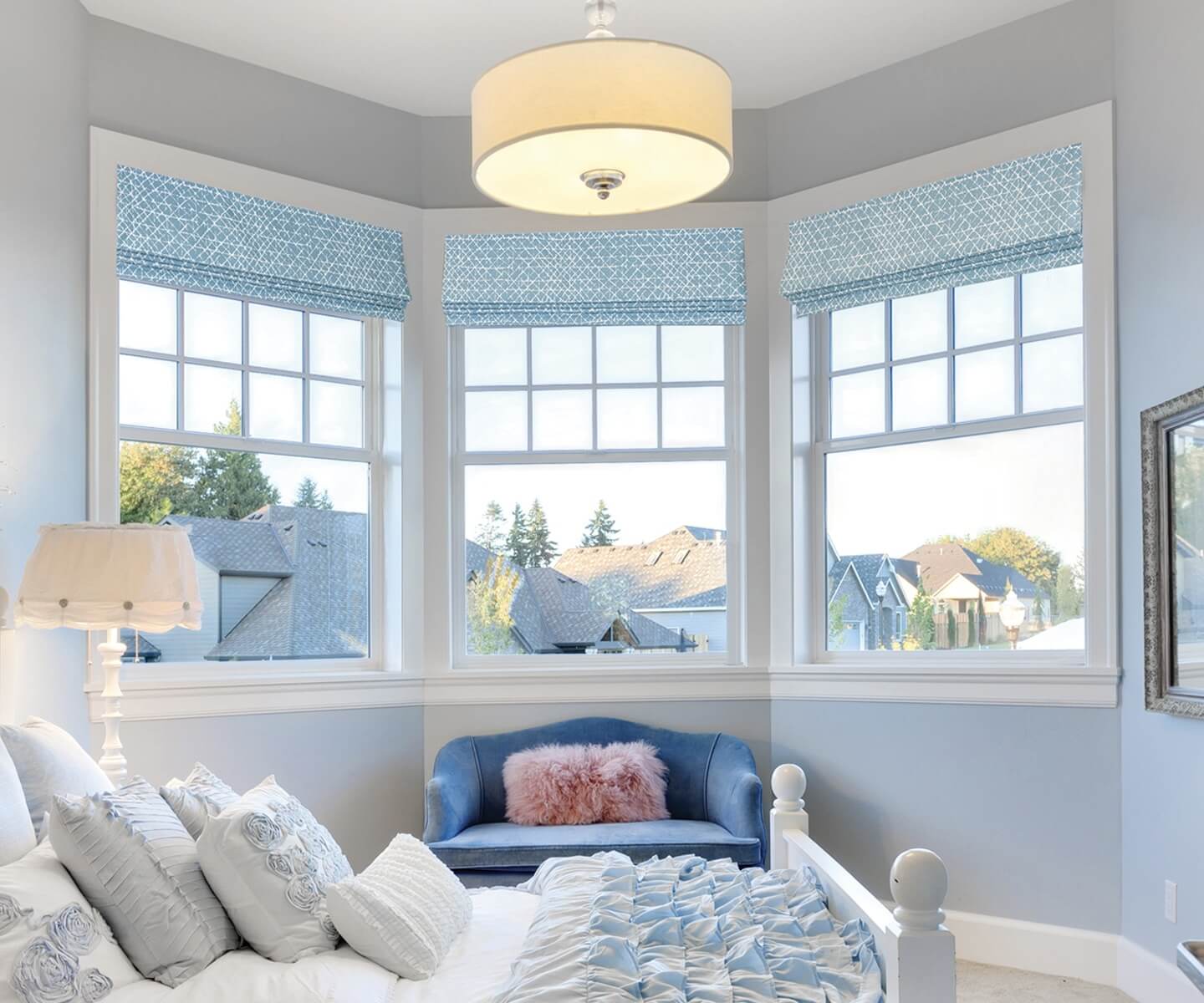 Elegant fabric roman shades adding a soft touch to a room.