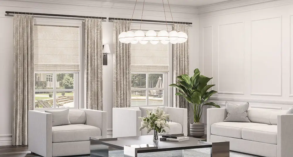 Elegant floor-to-ceiling Roman shades in a luxurious living room.